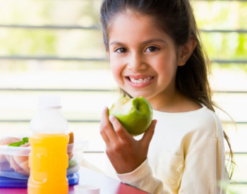 Hispanic child eating healty