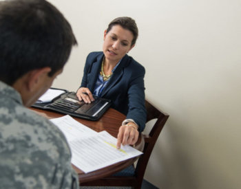 Brooke Fina, LCSW, associate professor of psychiatry, meets with a service member regarding a research study involving Prolonged Exposure therapy for PTSD.
