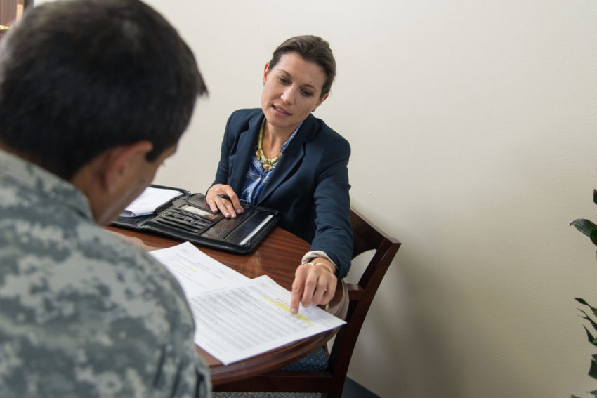 Brooke Fina, LCSW, associate professor of psychiatry, meets with a service member regarding a research study involving Prolonged Exposure therapy for PTSD.