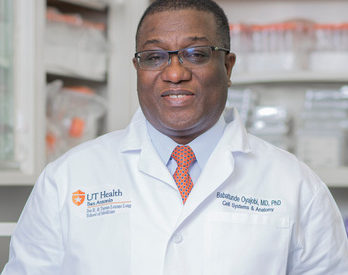 Dr. Oyajobi in white coat
