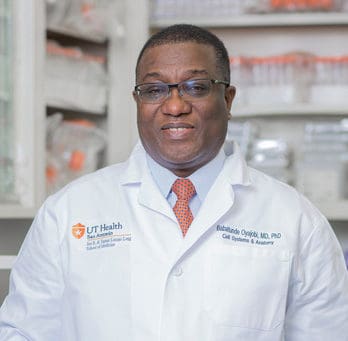 Dr. Oyajobi in white coat
