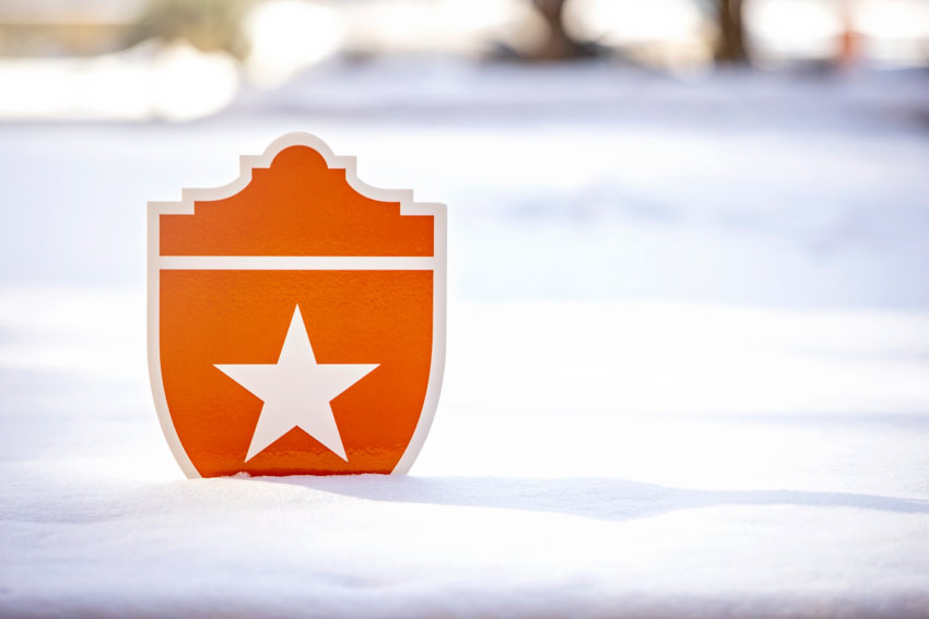 UT Health Shield in a snowy field