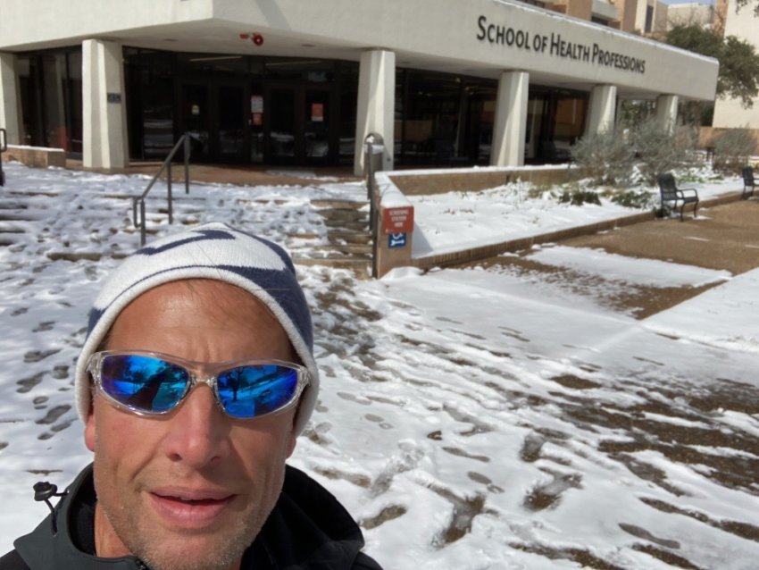 Michael Geelhoed, DPT, OCS, MTC, assistant professor and director of clinical education in the Department of Physical Therapy, stands in the snow on campus.