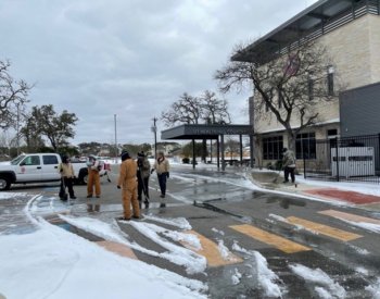Facilities Management crews help clear snow at UT Health Hill Country.