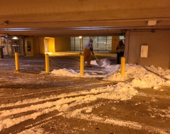 Facilities Management staff remove snow at the Medical Arts and Research Center.