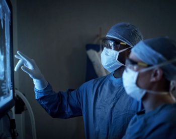 Photo of doctors looking at tumor images