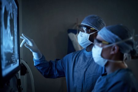 Photo of doctors looking at tumor images