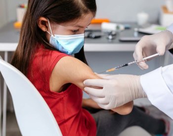 young girl gets vaccinated