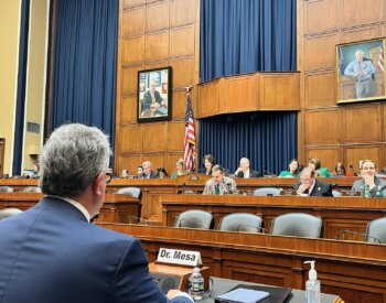 Photo of Dr. Ruben Mesa, cancer expert, speaking before a House subcommittee
