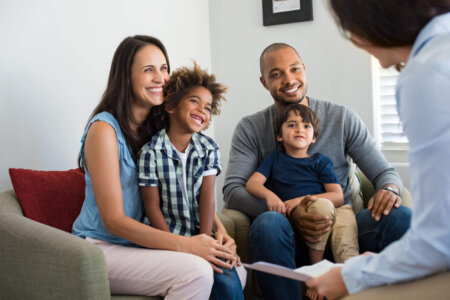 Foster family speaking with health provider