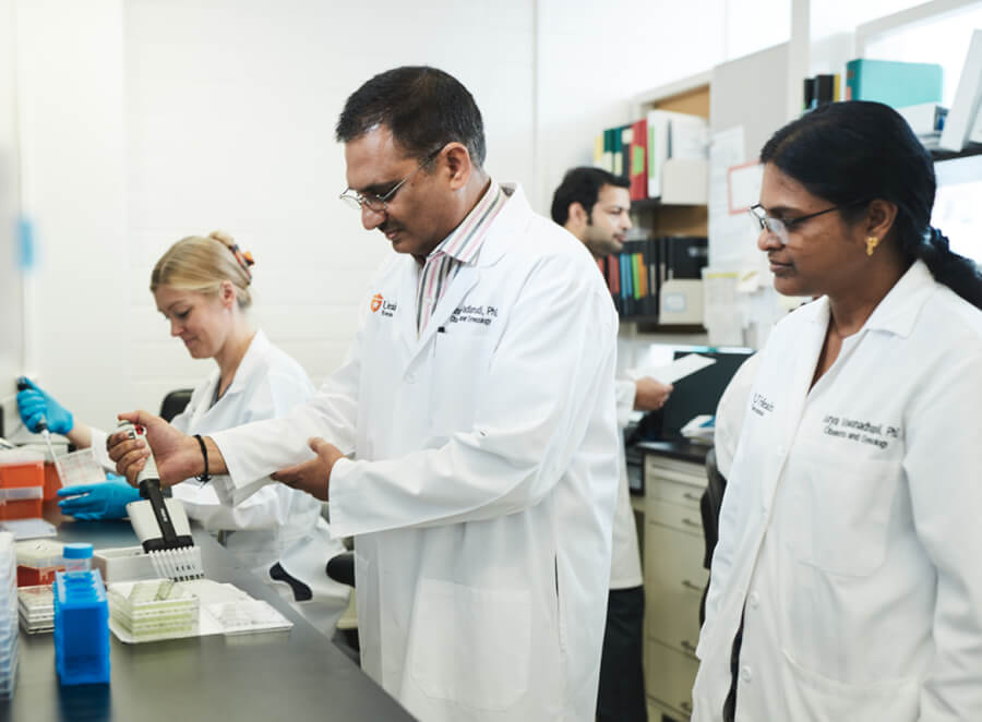 researchers work in a lab.