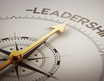 A compass pointing to the word leadership.