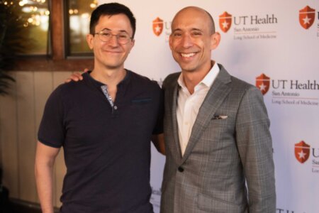 Long School of Medicine Class of 2024 graduate Grayson Means with Joshua Hanson, MD, MPH, professor and associate dean of student affairs