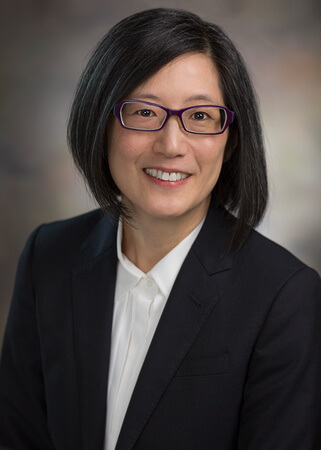 Head and shoulders photo of Dr. Chun in a suit.