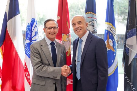 Byron C. Hepburn, M.D., FAAFP, Maj. Gen., United States Air Force, Ret., founding director of the Military Health Institute (MHI) at UT Health San Antonio, featured third from left, is presented with a commemorate plaque from his MHI colleagues during his recent retirement celebration.