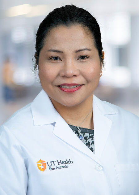 A headshot of Dr. Bluhm in her white coat.