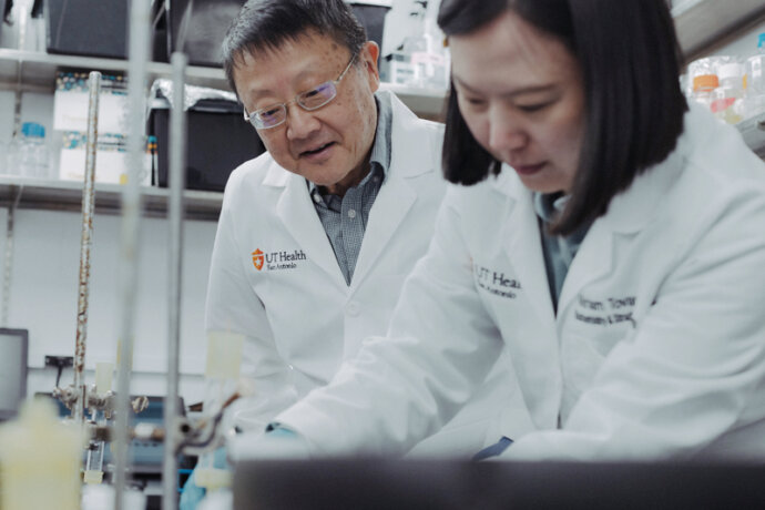 two scientists work in a research lab.