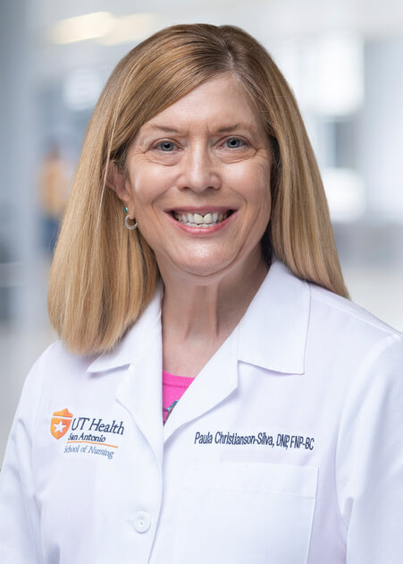 Dr. Christianson-Silva in her UT Health San Antonio white coat.