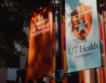 UT San Antonio banner outside of the Academic Learning and Teaching Center building.