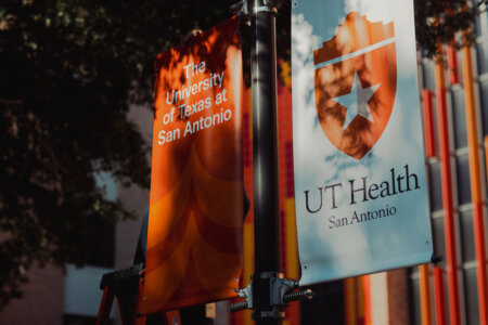 UT San Antonio banner outside of the Academic Learning and Teaching Center building.