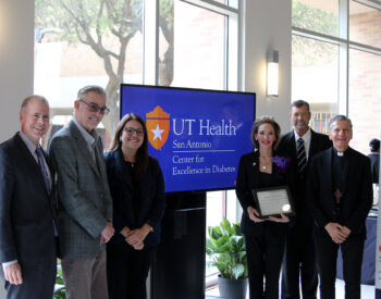 Leaders and honored guests gather for a photo.
