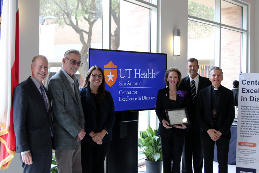 Leaders and honored guests gather for a photo.