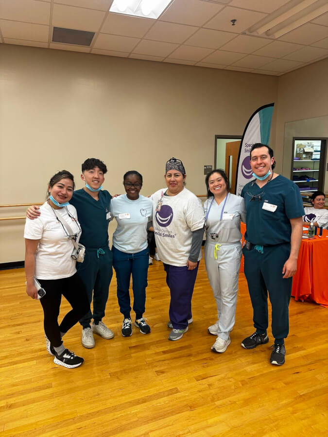 Dental providers take a group photo at the event.
