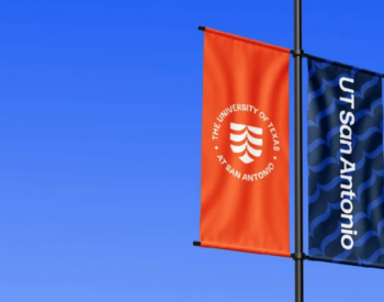 UT San Antonio banners fly on light pole.