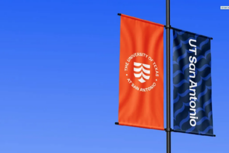 UT San Antonio banners fly on light pole.