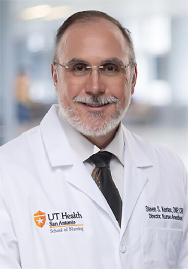 Head and shoulders photo of Steven Kertes in his clinical white coat.