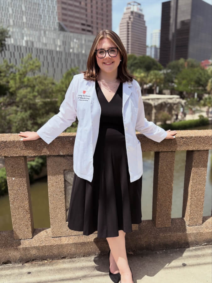 Class of 2030 medical student Alyssa Harig dons her white coat after the Joe R. and Tewresa Lozano Long School of Medicine's White Coat Ceremony.