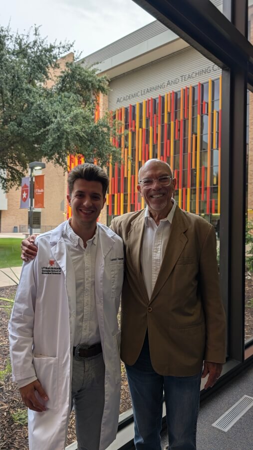 Laurence Maeyens (left) wears his white coat next to his Principal Investigator, James F. Nelson, Ph.D.Professor, Cellular and Integrative Physiology
