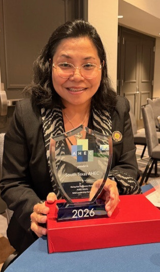 Photo of M. Danet Lapiz-Bluhm, PhD, RN, MSCI, FAAN, ANEF, professor, director of International Programs and program director of the South Texas Area Health Education Programs with the Inaugural Rising Star Advocacy Award.