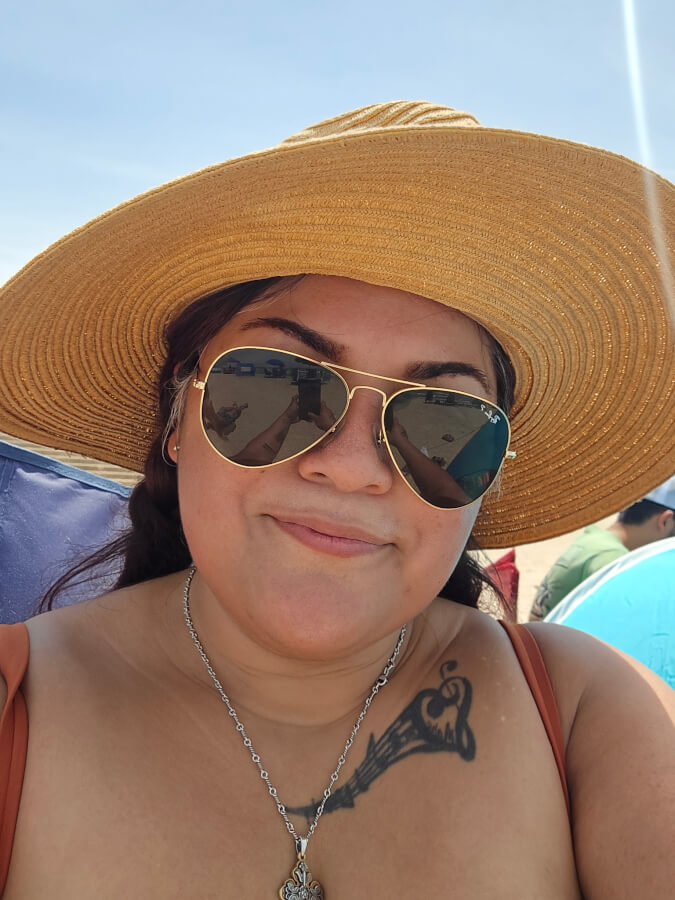 Airway surgery patient Alison Sendejo sits at the beach.