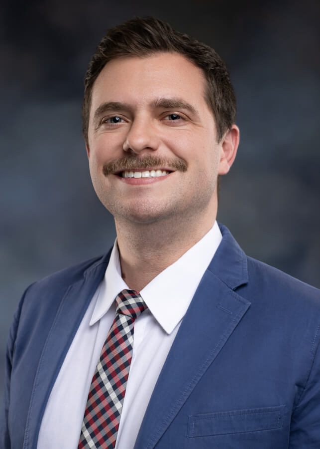 Dr. Jake Morgan in a tie and blazer.