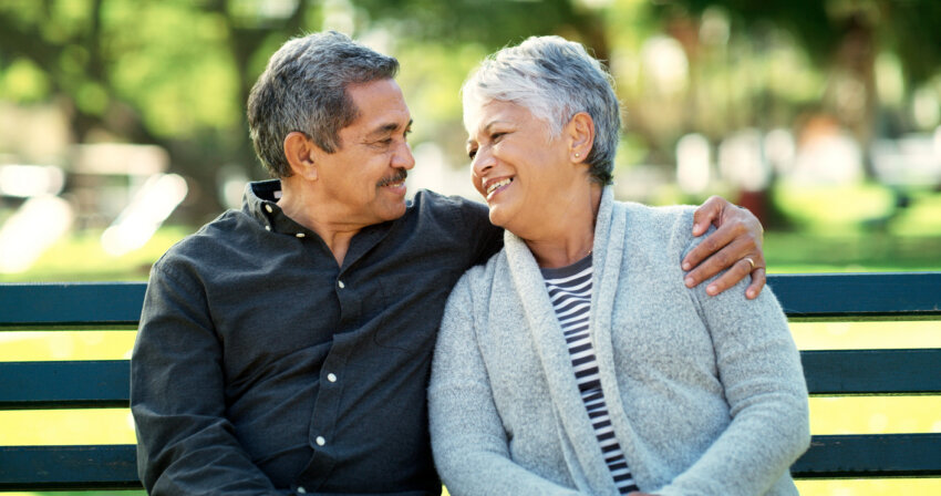 Image of older couple together outdoors.