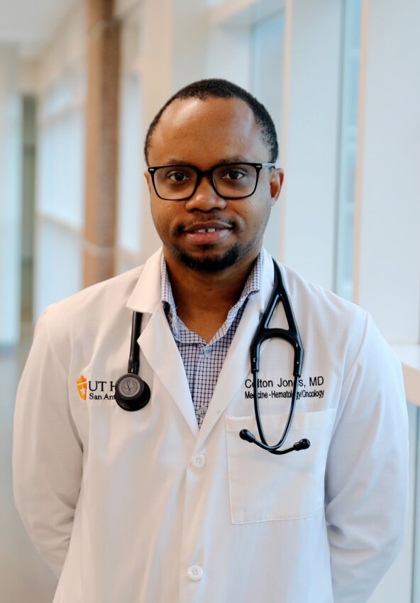 Portrit of man wearing white coat and stethoscope, Dr. Colton Jones.
